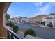 Community view with covered parking, lush landscaping, and well-maintained buildings at 3236 E Chandler Blvd # 1076, Phoenix, AZ 85048