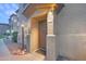 Inviting front door with warm lighting, decorative accents, and clear unit number 1076 at 3236 E Chandler Blvd # 1076, Phoenix, AZ 85048