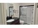 Clean bathroom with a walk-in shower and a dark vanity with a granite counter at 3345 E University Dr # 47, Mesa, AZ 85213