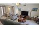 Cozy living room with comfortable seating, stylish decor, and tile flooring at 3345 E University Dr # 47, Mesa, AZ 85213