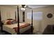 Relaxing bedroom with a beautiful four-poster bed and peaceful decor at 3345 E University Dr # 47, Mesa, AZ 85213