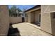 A private outdoor patio with tiled flooring, stucco walls and direct access to an exterior door at 3345 E University Dr # 47, Mesa, AZ 85213