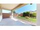 Cozy backyard with low-maintenance artificial grass, rock landscaping, and a covered patio at 3877 E Oxford Ln, Gilbert, AZ 85295