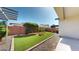 Private backyard with easy-care artificial grass, perfect for relaxing and entertaining in style at 3877 E Oxford Ln, Gilbert, AZ 85295