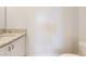 Partial view of a powder room bathroom with granite counter and toilet at 3877 E Oxford Ln, Gilbert, AZ 85295