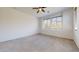 A spacious bedroom with large windows and neutral carpet, providing ample natural light at 3877 E Oxford Ln, Gilbert, AZ 85295