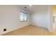 Bright bedroom featuring wood-look floors and plenty of natural light from the window at 3877 E Oxford Ln, Gilbert, AZ 85295
