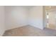 An inviting carpeted bedroom with neutral walls and view of hallway at 3877 E Oxford Ln, Gilbert, AZ 85295