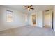 Spacious bedroom with en-suite bathroom and neutral carpet at 3877 E Oxford Ln, Gilbert, AZ 85295
