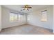 Large bedroom with carpet and multiple windows at 3877 E Oxford Ln, Gilbert, AZ 85295