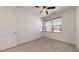 Bedroom with neutral walls, carpeting, door and three windows providing great light at 3877 E Oxford Ln, Gilbert, AZ 85295