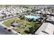 Aerial view of a community park featuring a pool, covered picnic area, and ample green space at 3877 E Oxford Ln, Gilbert, AZ 85295