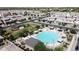 Aerial view of a community pool, green space, and surrounding homes in a residential neighborhood at 3877 E Oxford Ln, Gilbert, AZ 85295