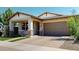 Charming single-story home featuring a two-car garage, covered entry and well-maintained landscaping at 3877 E Oxford Ln, Gilbert, AZ 85295