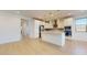 Bright kitchen with island, white cabinets and stainless steel appliances at 3877 E Oxford Ln, Gilbert, AZ 85295