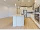 Kitchen with island, stainless appliances, tile backsplash, and bright, open layout at 3877 E Oxford Ln, Gilbert, AZ 85295
