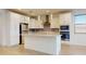 Bright kitchen features a large island and stainless steel appliances at 3877 E Oxford Ln, Gilbert, AZ 85295