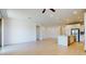 Bright and airy living space adjoining an open concept kitchen, featuring modern flooring at 3877 E Oxford Ln, Gilbert, AZ 85295