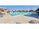 Community pool with surrounding lounge chairs, umbrellas, and clear blue water offers a refreshing outdoor experience at 3877 E Oxford Ln, Gilbert, AZ 85295