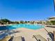 Community pool area with shaded lounge chairs offers a relaxing escape for residents at 3877 E Oxford Ln, Gilbert, AZ 85295