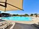 Inviting community pool with lounge seating, covered areas, and clear blue water for recreation at 3877 E Oxford Ln, Gilbert, AZ 85295