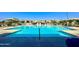 Community pool with blue water and sunshades provides residents with a relaxing outdoor retreat at 3877 E Oxford Ln, Gilbert, AZ 85295