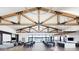Open community clubhouse interior with high ceilings, beam work and view of the pool at 39514 N Kaden Ln, San Tan Valley, AZ 85140