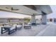 Outdoor patio seating area with modern furniture, ceiling fans, and desert views at 39514 N Kaden Ln, San Tan Valley, AZ 85140