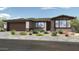 Charming single-story home featuring desert landscaping, a two-car garage, and a welcoming front entrance at 39604 N Kaden Ln, San Tan Valley, AZ 85140
