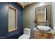 Charming bathroom featuring vessel sink, framed mirror, mosaic tile accents and a modern toilet at 401 N Cholla St, Chandler, AZ 85224