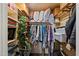 Functional closet with built-in shelving, hanging space, and overhead storage for clothes and accessories at 401 N Cholla St, Chandler, AZ 85224