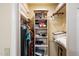 Efficient closet with hanging racks, shelves, and overhead storage for optimal organization at 401 N Cholla St, Chandler, AZ 85224