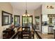 Formal dining room with elegant lighting and a view to the backyard at 401 N Cholla St, Chandler, AZ 85224