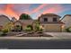 Charming two-story home with desert landscaping and an attached garage at 401 N Cholla St, Chandler, AZ 85224