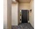 Stylish, modern front door with dark finish and decorative window features, welcoming entrance and brick paved patio at 401 N Cholla St, Chandler, AZ 85224