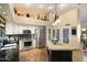 Bright kitchen featuring a granite countertop island and stainless steel appliances at 401 N Cholla St, Chandler, AZ 85224