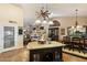 Open concept kitchen featuring a granite countertop island that connects to a dining area at 401 N Cholla St, Chandler, AZ 85224