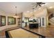 Spacious kitchen featuring stainless steel appliances, granite counters, kitchen island and adjacent dining area at 401 N Cholla St, Chandler, AZ 85224