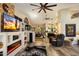 Spacious living room with an open floor plan, a fireplace and a large fan at 401 N Cholla St, Chandler, AZ 85224