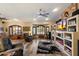 Inviting living room featuring a brick fireplace, and large windows with wood shutters at 401 N Cholla St, Chandler, AZ 85224