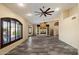 Spacious living room with a decorative fireplace, large windows, ceiling fans and plank flooring at 401 N Cholla St, Chandler, AZ 85224