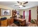 Home office boasts a large desk, custom cabinetry, and a cozy seating area, perfect for remote work at 401 N Cholla St, Chandler, AZ 85224