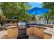 Outdoor kitchen with built-in grill, counter space, and patio area, perfect for outdoor entertaining at 401 N Cholla St, Chandler, AZ 85224