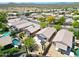 An aerial view of the houses in the community, a pool, and desert landscaping at 4045 E Desert Marigold Dr, Cave Creek, AZ 85331
