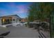 Desert landscaped backyard with the house and the covered patio at 4045 E Desert Marigold Dr, Cave Creek, AZ 85331