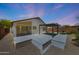 Charming backyard with a covered patio and low-maintenance desert landscaping at 4045 E Desert Marigold Dr, Cave Creek, AZ 85331