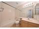 A view of a bathroom featuring a bathtub with a shower, toilet, sink and mirror at 4045 E Desert Marigold Dr, Cave Creek, AZ 85331