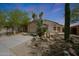 Attractive single-Gathering home with desert landscaping, including mature trees and native cacti at 4045 E Desert Marigold Dr, Cave Creek, AZ 85331