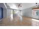 Bright living room featuring tile flooring, a ceiling fan, and ample natural light at 4045 E Desert Marigold Dr, Cave Creek, AZ 85331