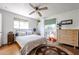 Bright bedroom with white walls, ceiling fan, and refinished concrete floors at 4142 N 35Th St, Phoenix, AZ 85018